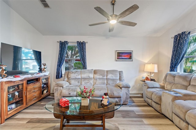 living room with ceiling fan and light wood-type flooring