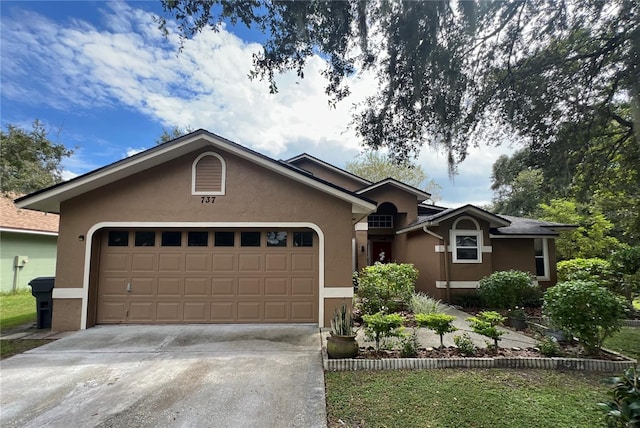 single story home featuring a garage