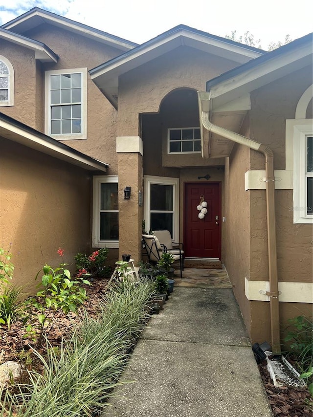 737 Butternut Pl, Lakeland, FL 33813 - doorway to property featuring stucco siding