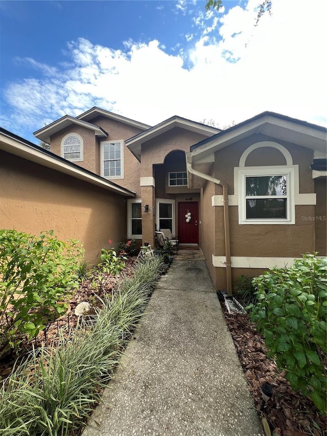 737 Butternut Pl, Lakeland, FL 33813 - entrance to property featuring stucco siding