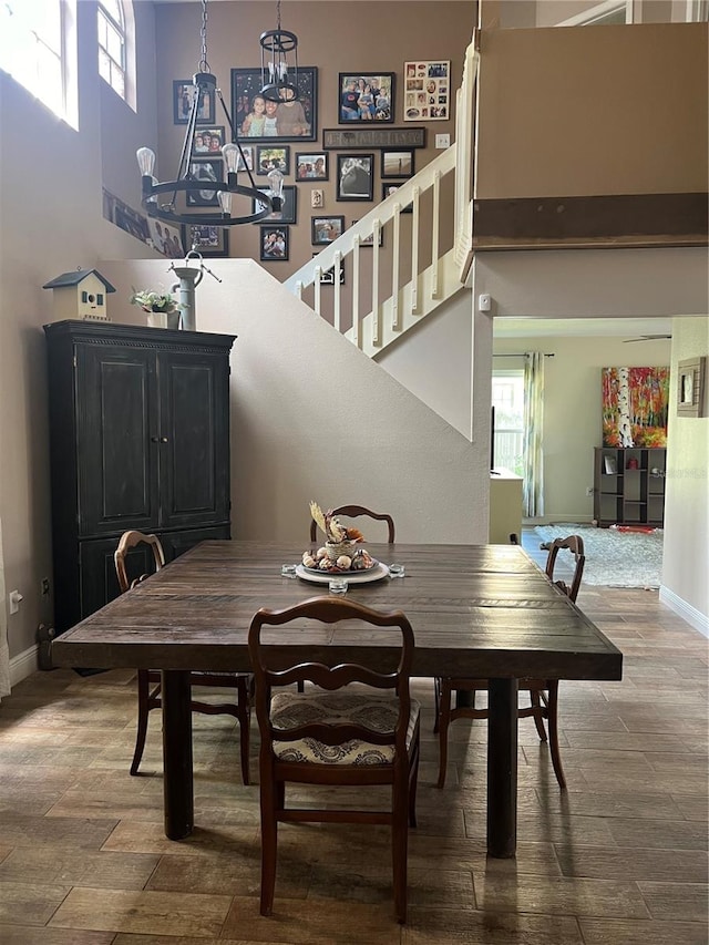 dining area with a towering ceiling