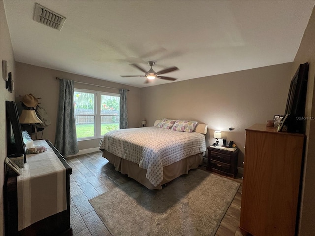 bedroom featuring hardwood / wood-style flooring and ceiling fan