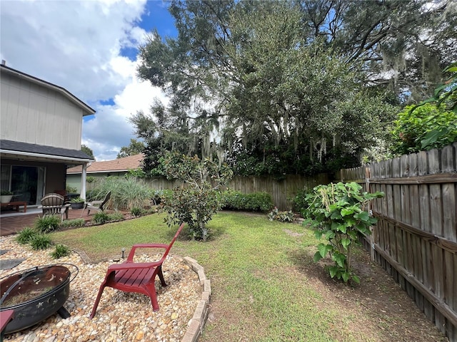 view of yard with a patio and a fire pit