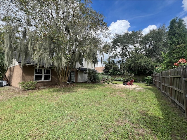 737 Butternut Pl, Lakeland, FL 33813 - view of yard with central AC unit and an outdoor fire pit