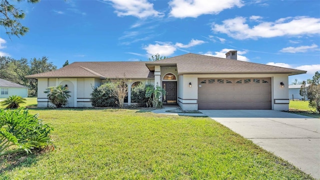 single story home featuring a front lawn and a garage