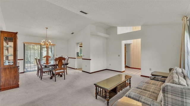 dining area with light carpet, a textured ceiling, high vaulted ceiling, and a notable chandelier