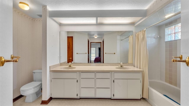 full bathroom featuring vanity, shower / bath combo, and toilet