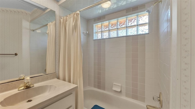 bathroom featuring vanity and shower / bath combo with shower curtain