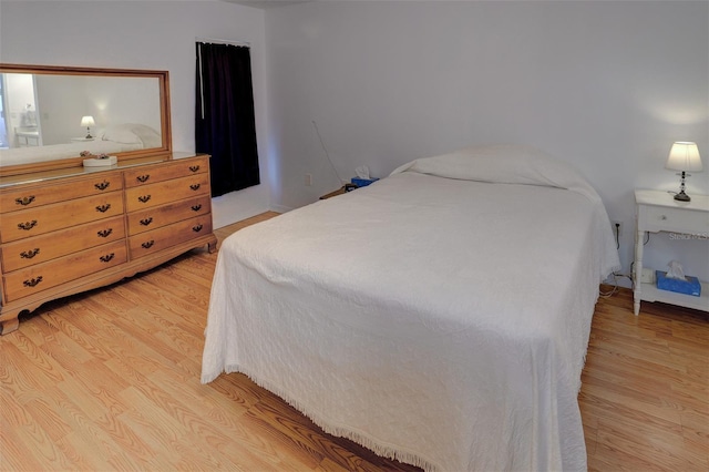 bedroom with light hardwood / wood-style flooring