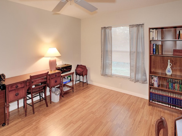 home office with ceiling fan, a healthy amount of sunlight, and light hardwood / wood-style flooring