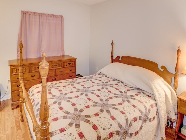 bedroom featuring wood-type flooring