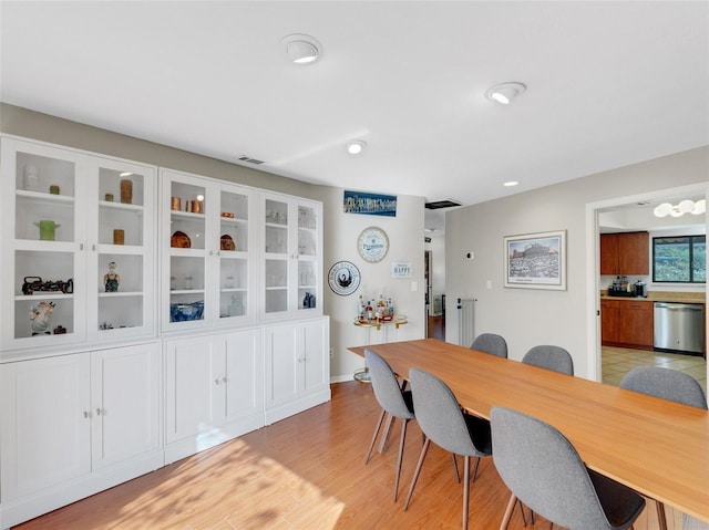 dining area with light hardwood / wood-style floors