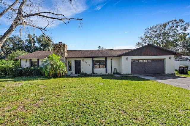 ranch-style house with a garage and a front yard