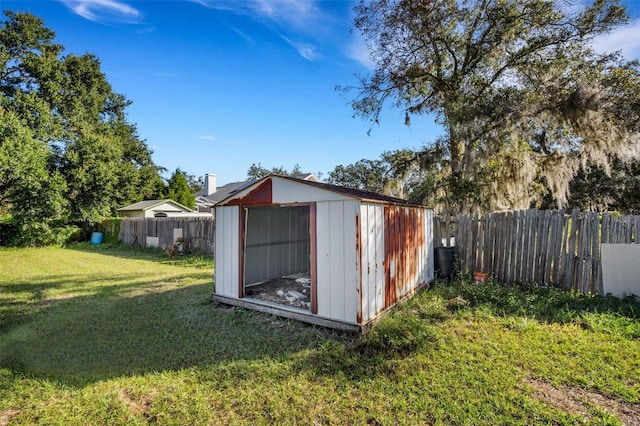 view of outdoor structure featuring a lawn