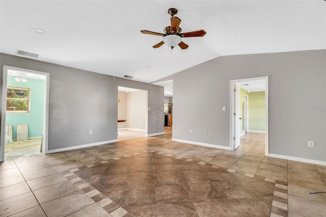 spare room featuring ceiling fan and vaulted ceiling