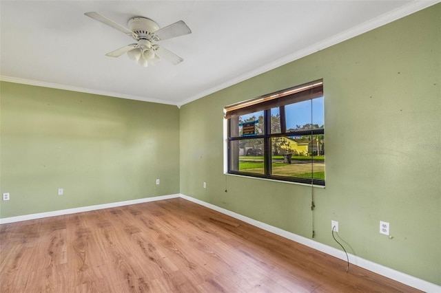 unfurnished room with ceiling fan, light hardwood / wood-style floors, and crown molding