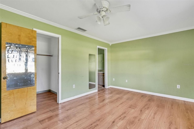 unfurnished bedroom with ornamental molding, ceiling fan, light hardwood / wood-style flooring, connected bathroom, and a closet