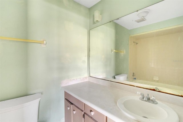 full bathroom featuring shower / bathing tub combination, vanity, and toilet