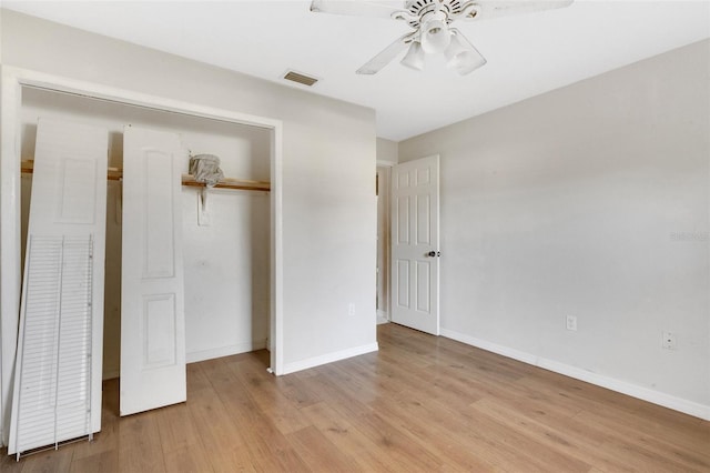 unfurnished bedroom with ceiling fan, a closet, and light hardwood / wood-style floors