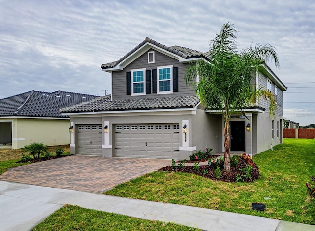 view of front of house featuring a front yard and a garage