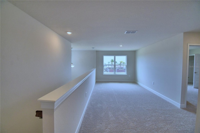 hallway featuring visible vents, recessed lighting, carpet floors, an upstairs landing, and baseboards