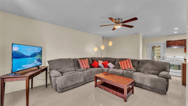 tiled living room with ceiling fan