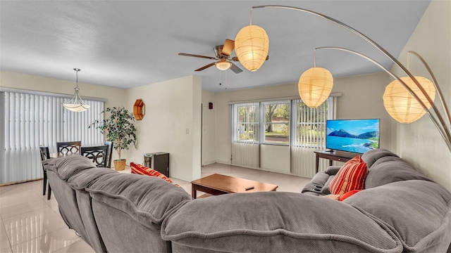 tiled living room with ceiling fan