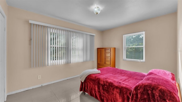 bedroom with light tile patterned flooring