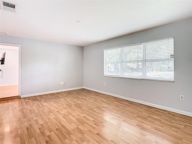 unfurnished room featuring light hardwood / wood-style floors