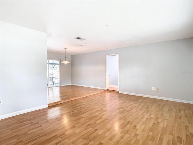 spare room featuring light hardwood / wood-style floors