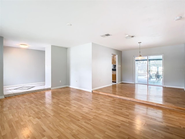 unfurnished room featuring light wood-type flooring