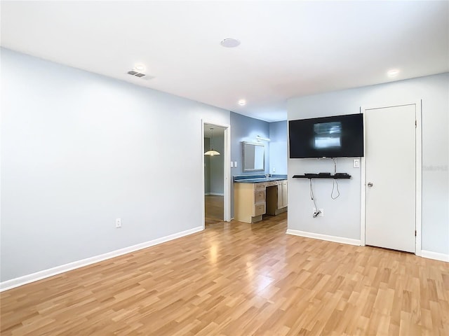 unfurnished living room featuring light hardwood / wood-style flooring