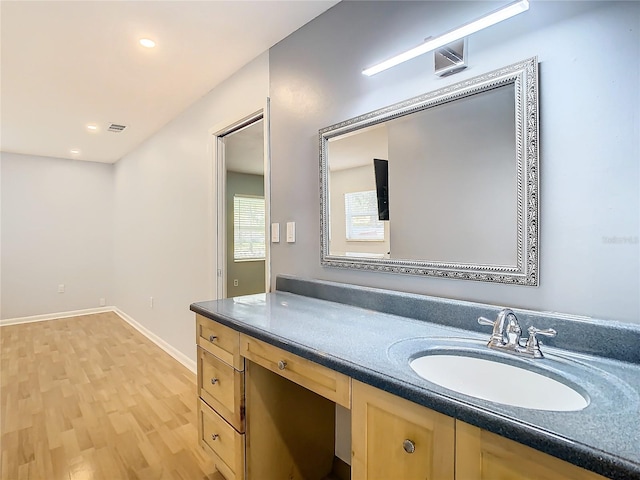 bathroom with vanity and hardwood / wood-style flooring