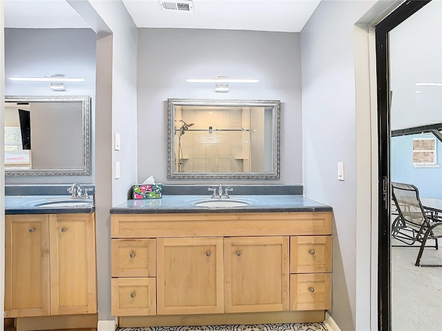 bathroom with a shower and vanity