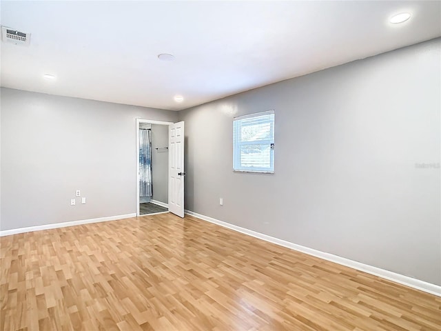 spare room with light hardwood / wood-style floors