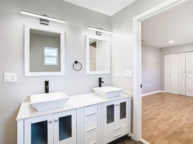 bathroom featuring vanity and hardwood / wood-style flooring