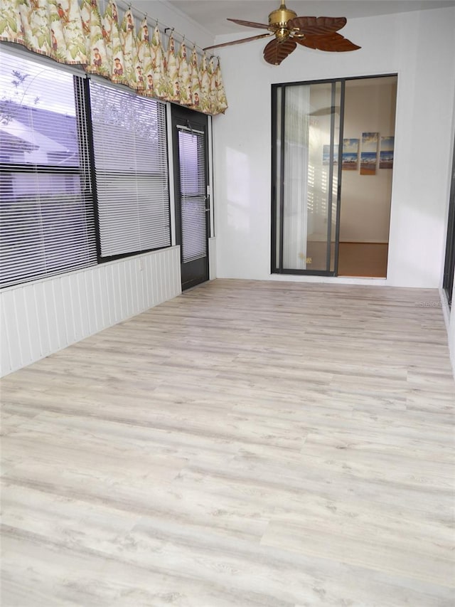 spare room featuring ceiling fan and light hardwood / wood-style floors