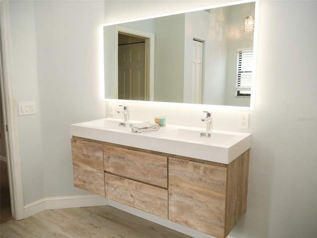 bathroom featuring hardwood / wood-style floors and vanity