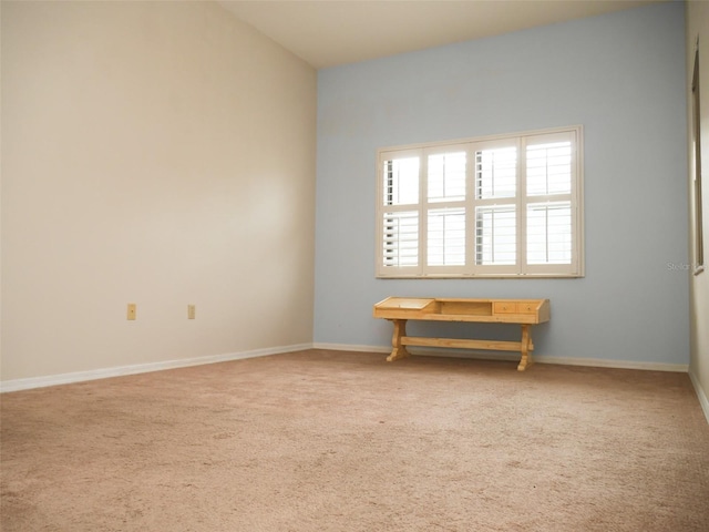 unfurnished room featuring carpet