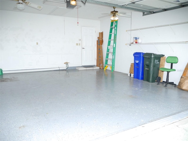 garage with a garage door opener and ceiling fan