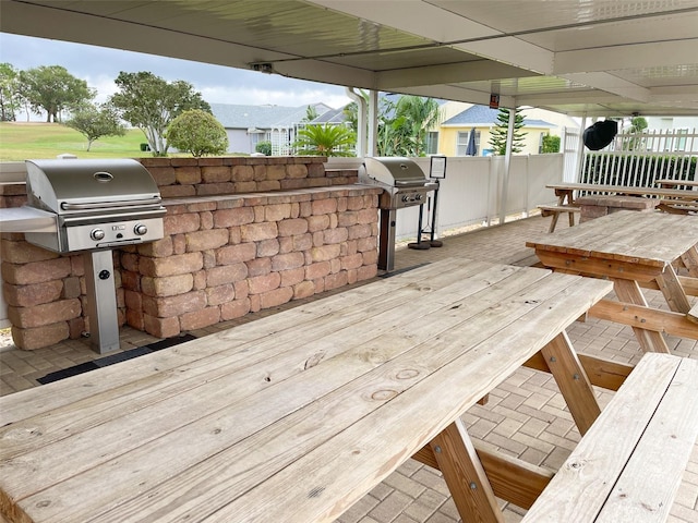 wooden deck with a grill