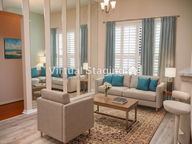 living room featuring light hardwood / wood-style floors and a chandelier