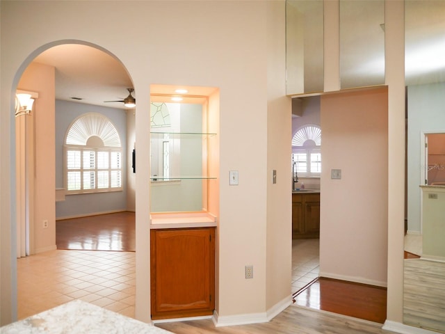 corridor featuring light tile patterned floors