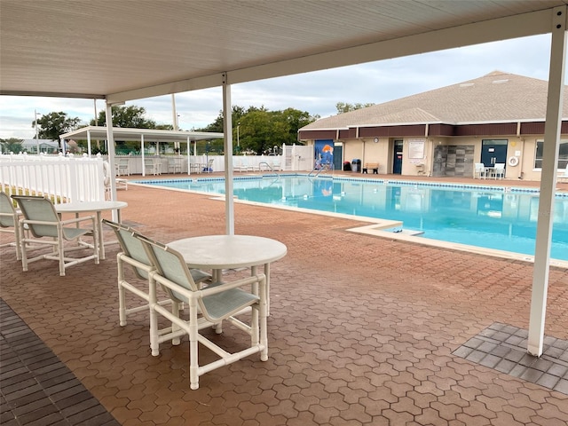 view of swimming pool with a patio