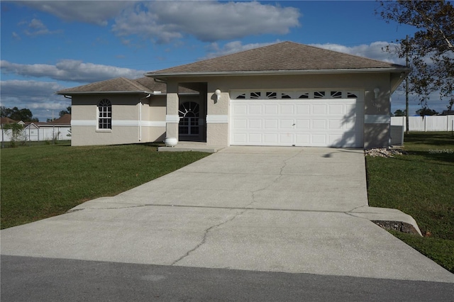 view of front facade featuring a front yard and a garage