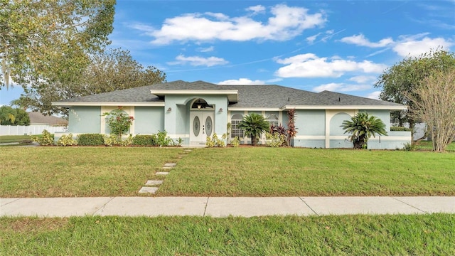 single story home with a front yard