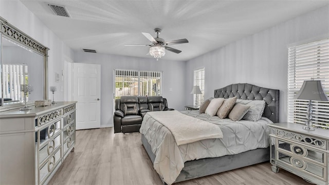 bedroom with ceiling fan and light wood-type flooring