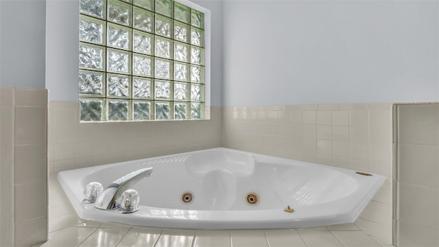 bathroom featuring tiled bath