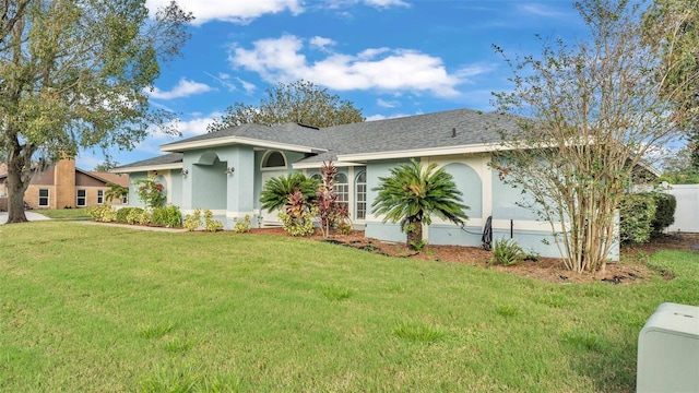 ranch-style house with a front lawn