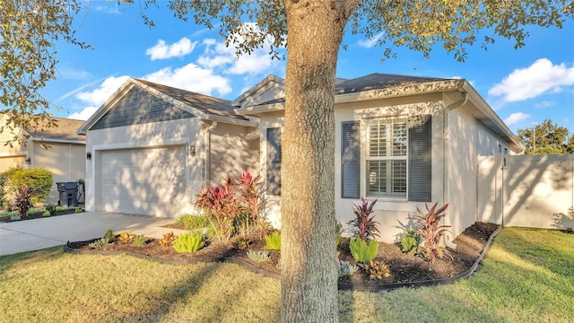 view of front of home with a garage and a front lawn